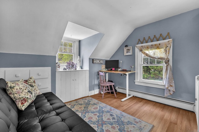18 Lynde St, Old Saybrook, CT 06475 - living room with baseboard heating, vaulted ceiling, and wood finished floors