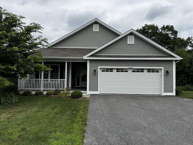 4 Skylark Ln Unit 4, Killingly, CT 06239 - view of front of house featuring asphalt driveway, a porch, a front yard, an attached garage, and roof with shingles