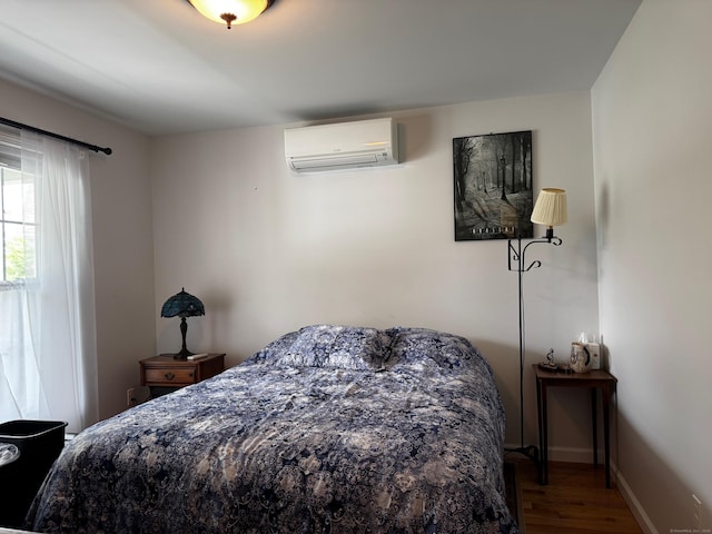 4 Skylark Ln Unit 4, Killingly, CT 06239 - bedroom with an AC wall unit and wood finished floors