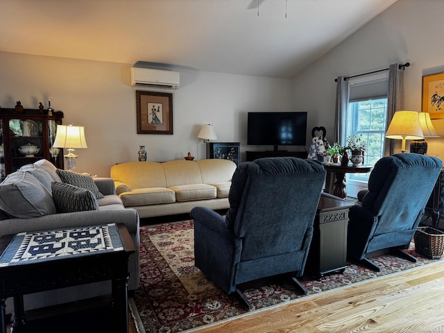 4 Skylark Ln Unit 4, Killingly, CT 06239 - living area featuring a wall mounted air conditioner, vaulted ceiling, wood finished floors, and ceiling fan