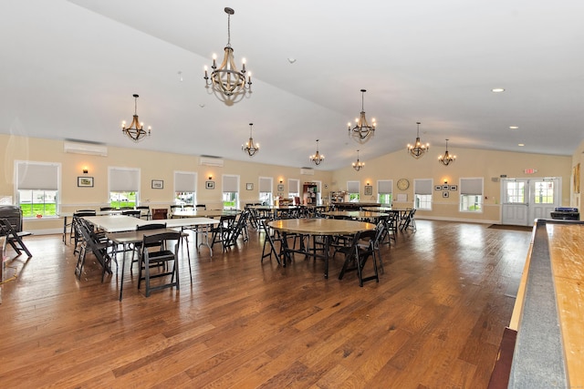 4 Skylark Ln Unit 4, Killingly, CT 06239 - dining area with a chandelier, a wall mounted AC, vaulted ceiling, plenty of natural light, and wood finished floors