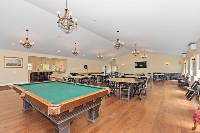 4 Skylark Ln Unit 4, Killingly, CT 06239 - rec room with a chandelier, lofted ceiling, a wall unit AC, wood finished floors, and billiards table