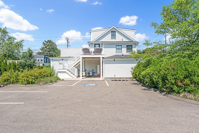 44 Williams St, Stonington, CT 06379 - view of front of property featuring stairway and uncovered parking
