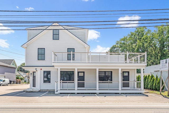 44 Williams St, Stonington, CT 06379 - view of front of house with a balcony and covered porch