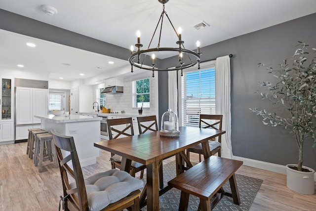 44 Williams St, Stonington, CT 06379 - dining space with a chandelier, light wood-style flooring, and recessed lighting