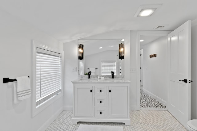 44 Williams St, Stonington, CT 06379 - bathroom featuring vaulted ceiling and double vanity