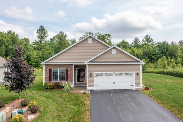 32 Mockingbird Dr Unit 32, Killingly, CT 06239 - view of front of house featuring driveway, a front lawn, and a garage