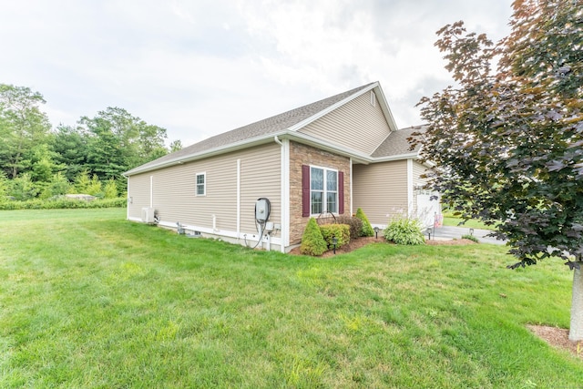 32 Mockingbird Dr Unit 32, Killingly, CT 06239 - view of side of property with a yard and roof with shingles
