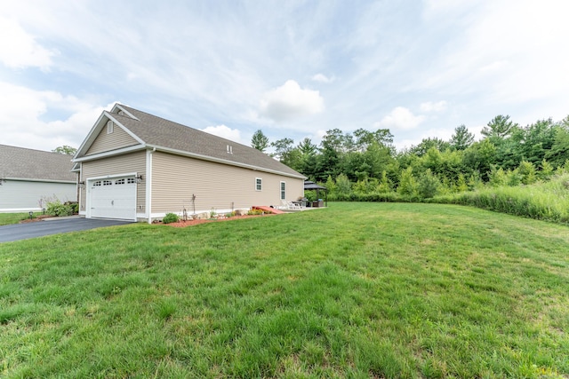 32 Mockingbird Dr Unit 32, Killingly, CT 06239 - view of home's exterior with asphalt driveway, a garage, and a lawn