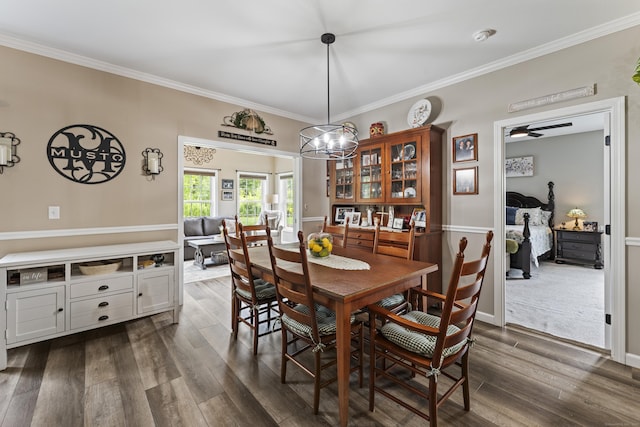 32 Mockingbird Dr Unit 32, Killingly, CT 06239 - dining area featuring crown molding and dark wood-type flooring