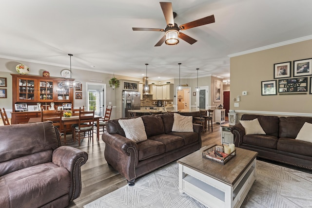 32 Mockingbird Dr Unit 32, Killingly, CT 06239 - living room featuring ceiling fan, wood finished floors, and ornamental molding