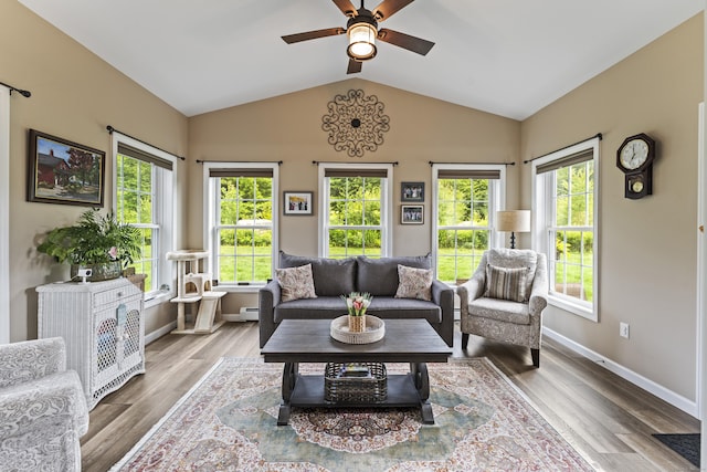 32 Mockingbird Dr Unit 32, Killingly, CT 06239 - living room with ceiling fan, plenty of natural light, lofted ceiling, wood finished floors, and baseboard heating