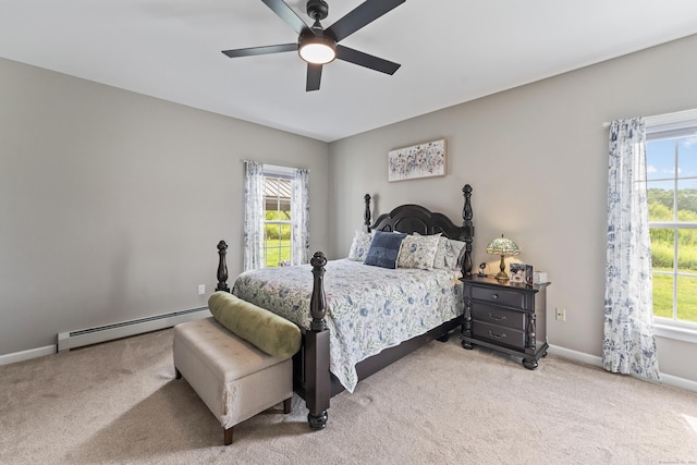 32 Mockingbird Dr Unit 32, Killingly, CT 06239 - bedroom with a baseboard heating unit, light carpet, and ceiling fan