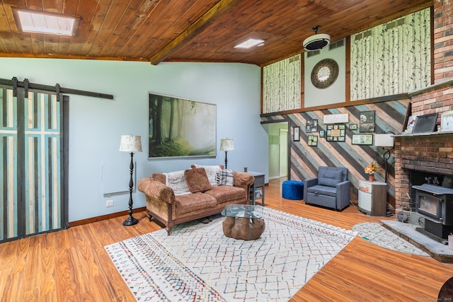 93 Kettletown Woods Rd, Southbury, CT 06488 - living area featuring a wood stove, wood ceiling, a barn door, wood finished floors, and vaulted ceiling