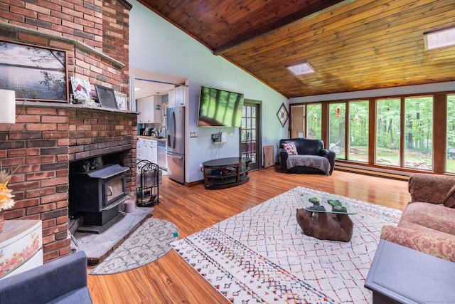 93 Kettletown Woods Rd, Southbury, CT 06488 - living room with a wood stove, wood finished floors, wood ceiling, baseboard heating, and high vaulted ceiling