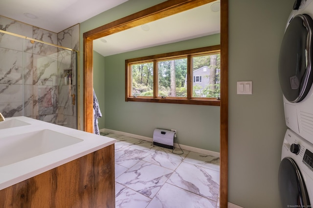 93 Kettletown Woods Rd, Southbury, CT 06488 - washroom with stacked washer / dryer and light marble finish flooring