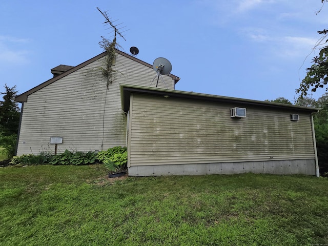 947 Ekonk Hill Rd, Voluntown, CT 06384 - view of property exterior with a lawn and an AC wall unit