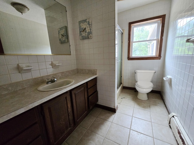 947 Ekonk Hill Rd, Voluntown, CT 06384 - full bath with a baseboard radiator, tile walls, vanity, an enclosed shower, and tile patterned floors