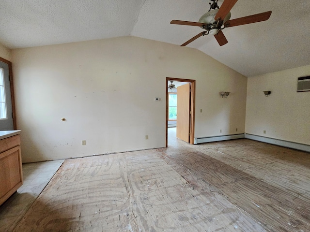 947 Ekonk Hill Rd, Voluntown, CT 06384 - empty room featuring lofted ceiling, a ceiling fan, a wall unit AC, baseboard heating, and a textured ceiling