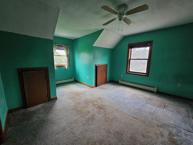 947 Ekonk Hill Rd, Voluntown, CT 06384 - additional living space with baseboard heating, a ceiling fan, carpet floors, lofted ceiling, and a textured ceiling