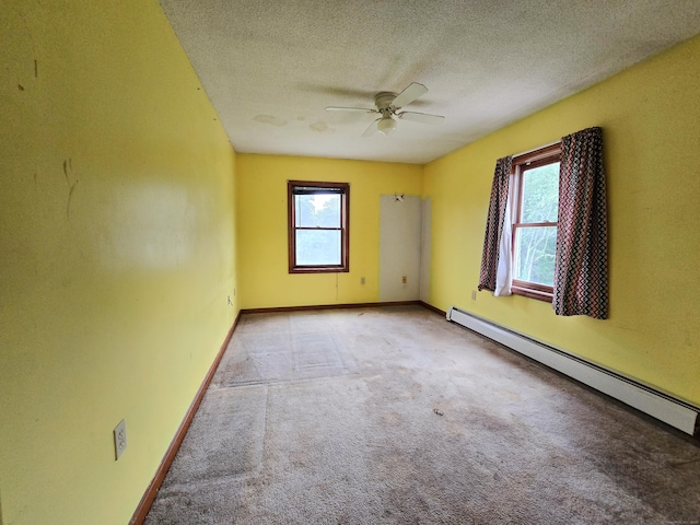947 Ekonk Hill Rd, Voluntown, CT 06384 - unfurnished room featuring a baseboard heating unit, carpet, ceiling fan, and a textured ceiling