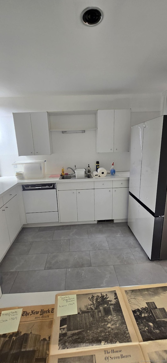 100 Mildred Ave, Waterbury, CT 06708 - kitchen with white appliances, white cabinetry, light countertops, and light tile patterned flooring