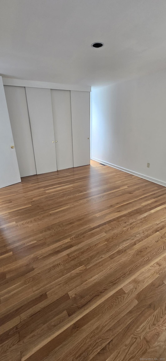 100 Mildred Ave, Waterbury, CT 06708 - unfurnished bedroom with wood finished floors and a closet