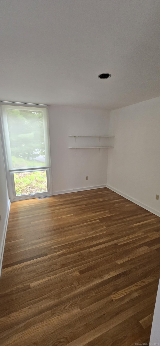 100 Mildred Ave, Waterbury, CT 06708 - unfurnished room featuring dark wood-type flooring and baseboards