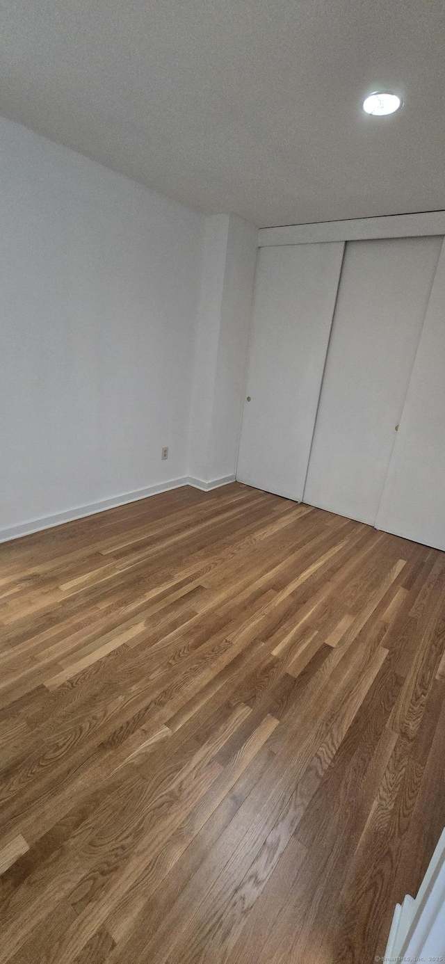 100 Mildred Ave, Waterbury, CT 06708 - unfurnished bedroom with wood finished floors, recessed lighting, and a closet