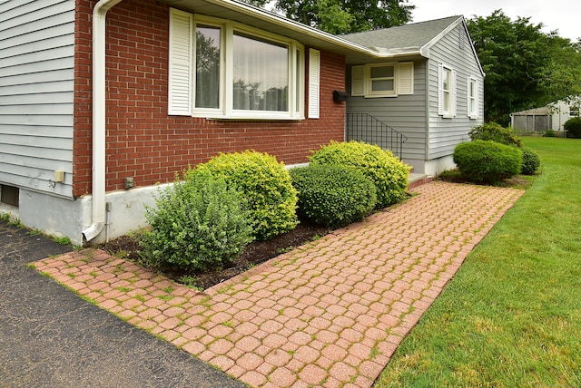 20 Tumble Brook Rd, Rocky Hill, CT 06067 - view of front of house with brick siding and a front lawn