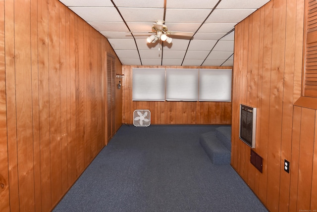 20 Tumble Brook Rd, Rocky Hill, CT 06067 - empty room with carpet, wood walls, ceiling fan, heating unit, and a paneled ceiling