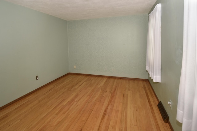 20 Tumble Brook Rd, Rocky Hill, CT 06067 - empty room with light wood-type flooring and baseboards
