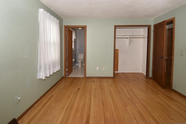 20 Tumble Brook Rd, Rocky Hill, CT 06067 - unfurnished bedroom featuring light wood finished floors, a closet, and connected bathroom