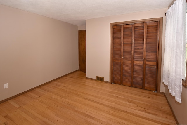 20 Tumble Brook Rd, Rocky Hill, CT 06067 - unfurnished bedroom featuring light wood-type flooring and a closet