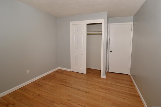 20 Tumble Brook Rd, Rocky Hill, CT 06067 - unfurnished bedroom with light wood-style flooring and a closet