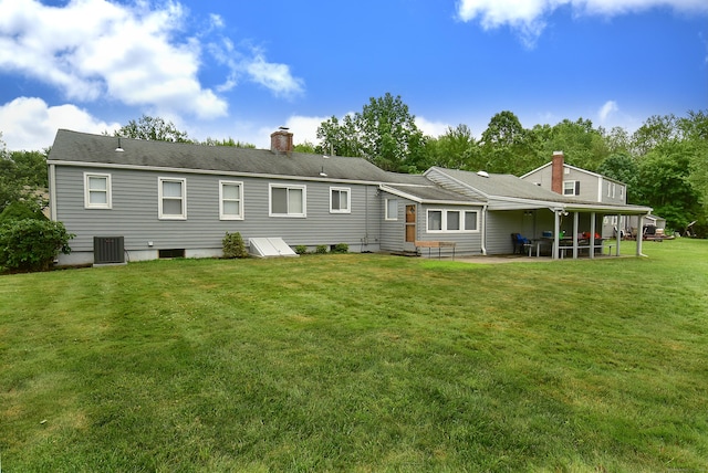 20 Tumble Brook Rd, Rocky Hill, CT 06067 - back of property featuring a chimney, a patio, and a yard