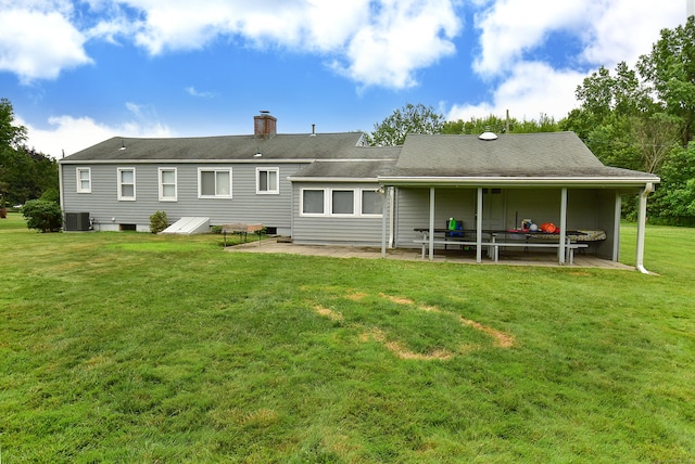 20 Tumble Brook Rd, Rocky Hill, CT 06067 - rear view of property featuring a patio, a lawn, and a chimney