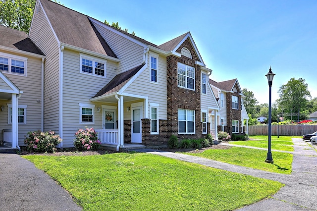 25 Janet Cir Unit F, Bridgeport, CT 06606 - traditional-style home with roof with shingles and brick siding