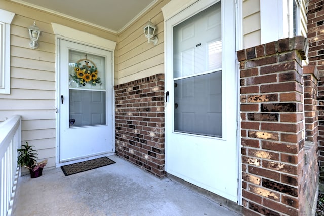 25 Janet Cir Unit F, Bridgeport, CT 06606 - doorway to property featuring brick siding and covered porch