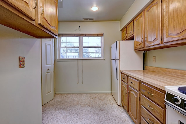 25 Janet Cir Unit F, Bridgeport, CT 06606 - kitchen featuring white appliances, light carpet, light countertops, and brown cabinetry