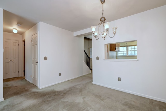 25 Janet Cir Unit F, Bridgeport, CT 06606 - unfurnished room featuring stairway, carpet floors, a chandelier, and a smoke detector
