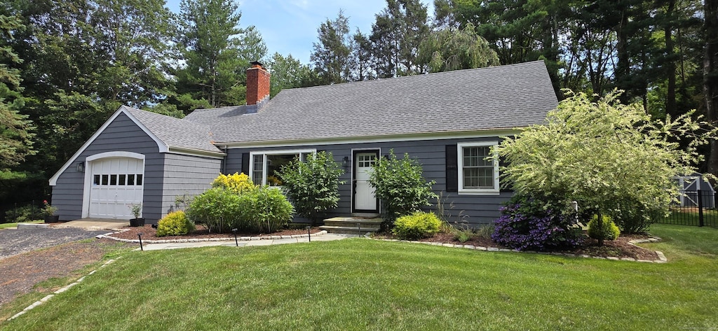 79 N St, Trumbull, CT 06611 - view of front of property featuring a chimney, driveway, a shingled roof, and an attached garage
