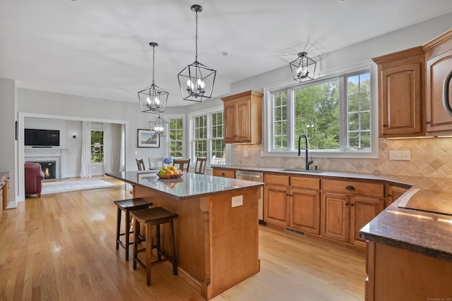 36 Blueberry Ln, Canton, CT 06019 - kitchen with a chandelier, light wood-style floors, and backsplash