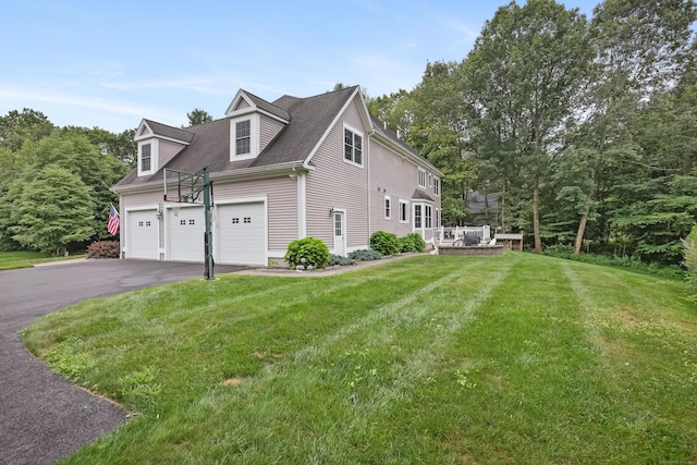 36 Blueberry Ln, Canton, CT 06019 - view of property exterior featuring asphalt driveway, a yard, and a wooden deck