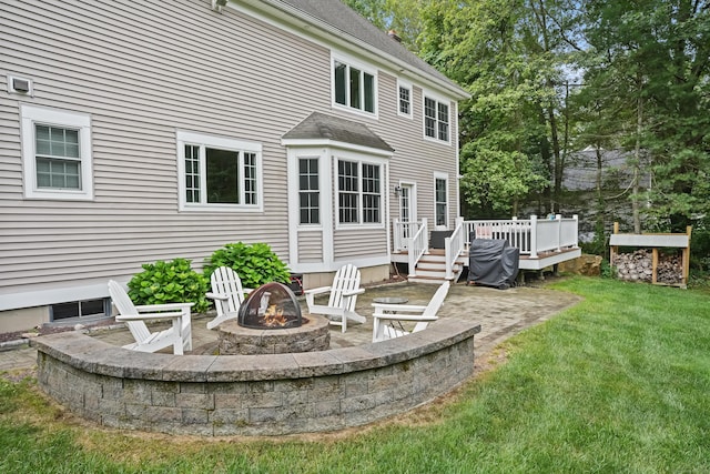 36 Blueberry Ln, Canton, CT 06019 - back of house featuring an outdoor fire pit, a deck, a lawn, a shingled roof, and a patio area