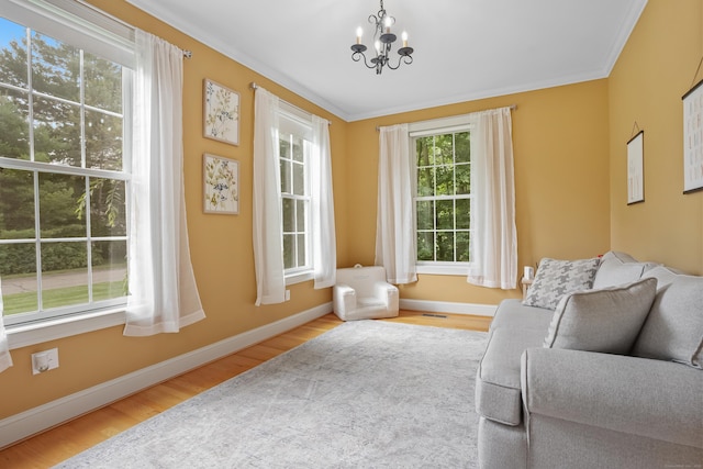 36 Blueberry Ln, Canton, CT 06019 - living area featuring wood finished floors, a chandelier, and ornamental molding