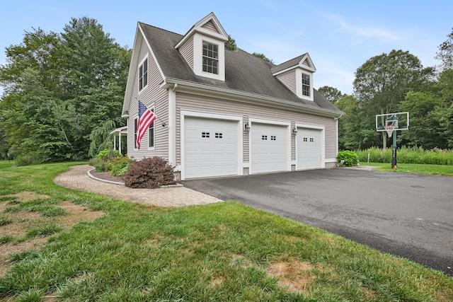 36 Blueberry Ln, Canton, CT 06019 - view of home's exterior featuring driveway, roof with shingles, and a lawn