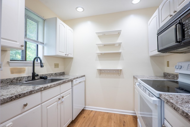 19 Somers St Unit D1, Danbury, CT 06810 - kitchen featuring white appliances, light wood finished floors, white cabinetry, light countertops, and recessed lighting