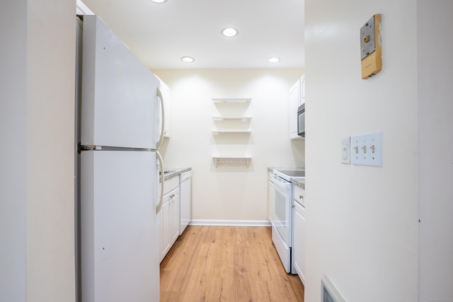 19 Somers St Unit D1, Danbury, CT 06810 - kitchen featuring white appliances, light wood-style flooring, white cabinets, recessed lighting, and light countertops