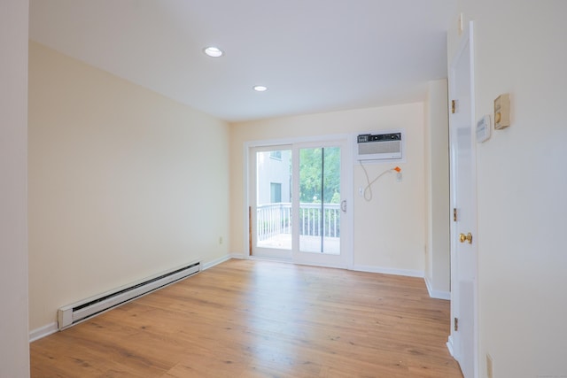 19 Somers St Unit D1, Danbury, CT 06810 - unfurnished room with baseboard heating, a wall mounted AC, light wood-type flooring, and recessed lighting
